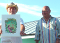 King RIchard and Board member,  Lou Demek present winning artwork for the official MangoMania 2012 t-shirt. Winner is Kristine (Birdi) Smock
